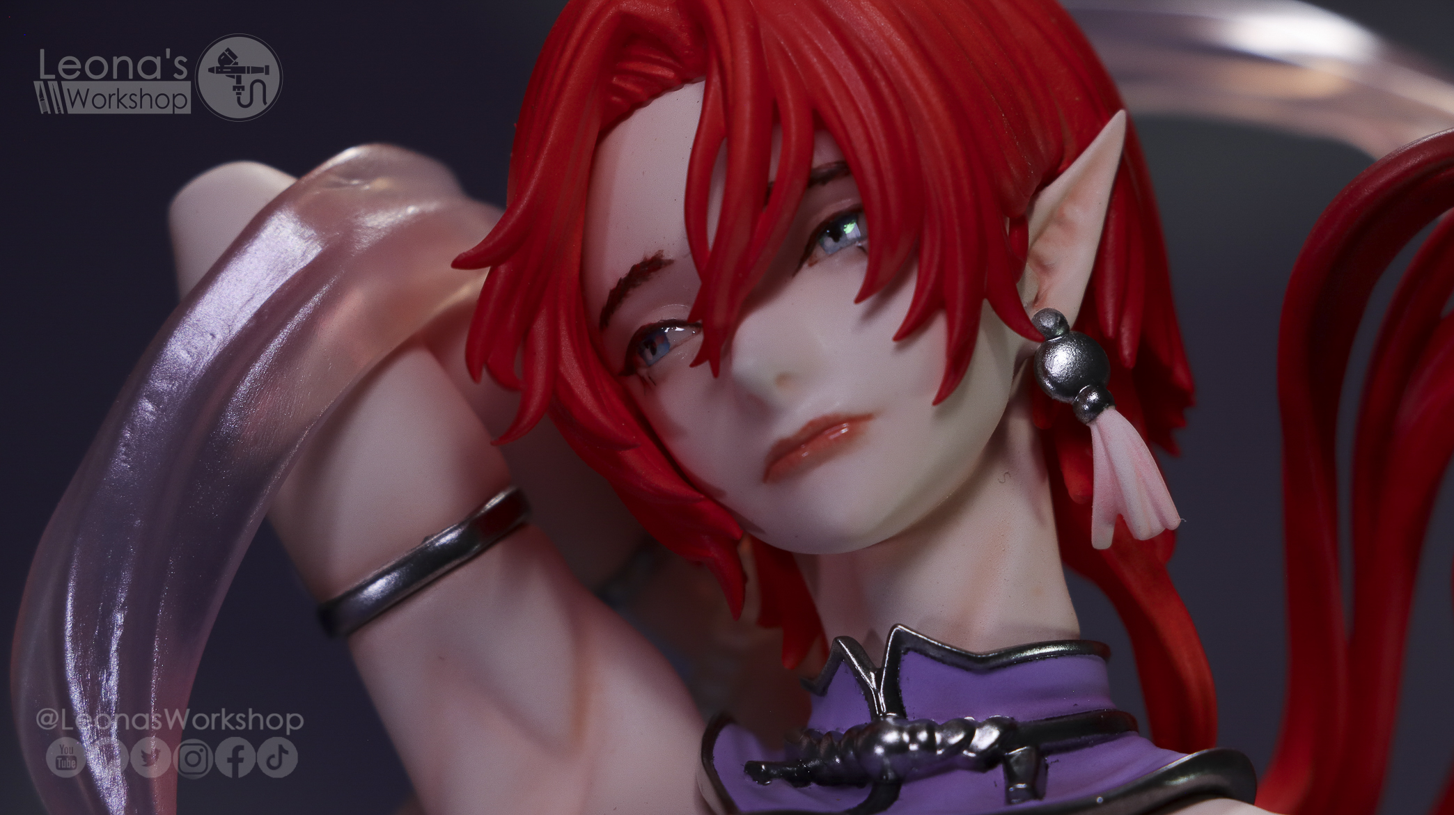 Painted elf-eared figure with red hair
